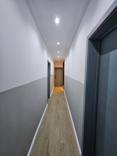 a hallway with a hallway leading to a door at 7th generation apartments limited in Lagos