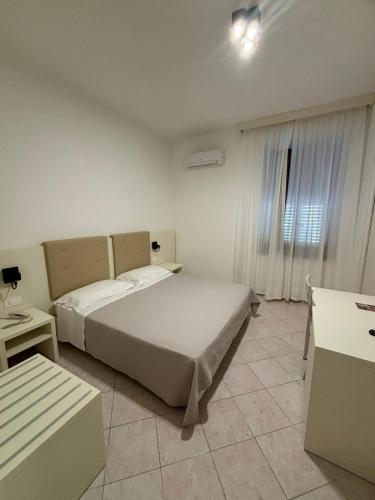 Katil atau katil-katil dalam bilik di Hotel La Margherita & SPA