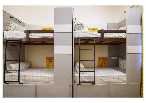 two sets of bunk beds in a room at The Pune Story in Pune