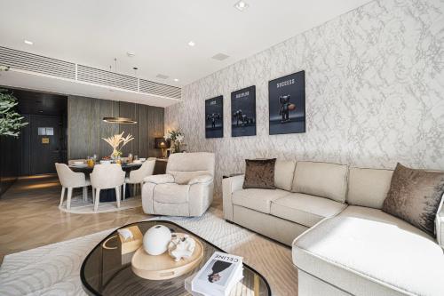 a living room with a couch and a table at FIVE Palm Jumeirah Premier Apartments in Dubai
