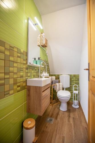 a bathroom with a sink and a toilet at Apartment Lasica for 4 persons in Jasenak