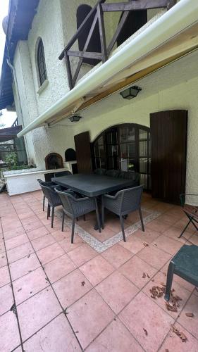 a ping pong table on a patio outside of a building at Villa by Lake Sapanca in Sapanca