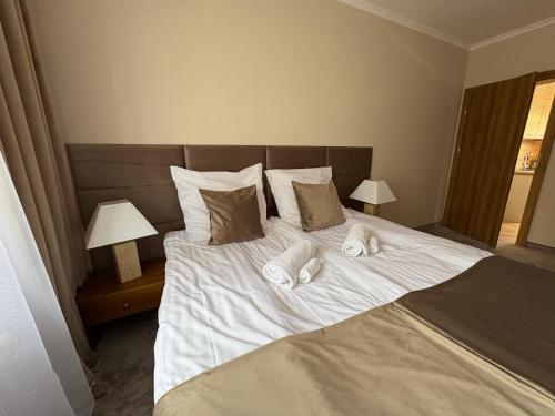 Ένα ή περισσότερα κρεβάτια σε δωμάτιο στο Apartamenty Uchnasta