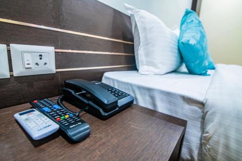 Postel nebo postele na pokoji v ubytování Hotel Shams Inn