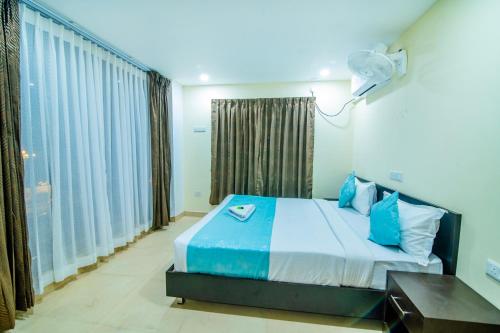 Postel nebo postele na pokoji v ubytování Hotel Shams Inn