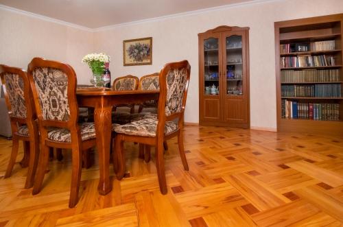 a dining room with a wooden table and chairs at Cozy House And Yard Old Tbilisi Center in Tbilisi City