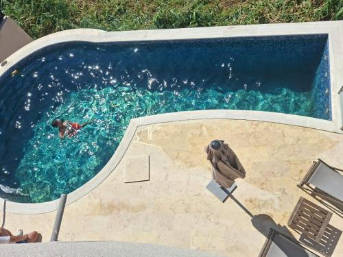 a swimming pool with a person in the water at Apartments Melisa in Ulcinj