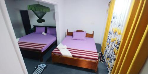 Postel nebo postele na pokoji v ubytování Mango Villa - Panama Near Arugam Bay
