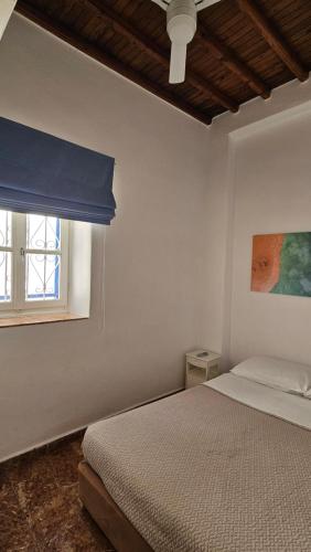 Postel nebo postele na pokoji v ubytování Eleanna's Mykonos