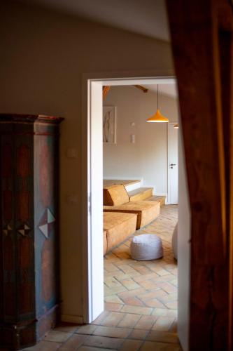 a view of a living room with a bed and a hallway at Große Wohnung mit Loggia in Templin