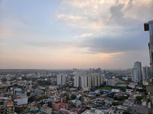 a view of a city with tall buildings at LuxePink Teddd Jucuzzi Studio-PrivatePatio in Gurgaon