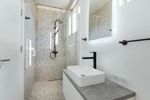 a white bathroom with a sink and a shower at *NEW IN 2025* - Hotel Subra Atrium in Herceg-Novi
