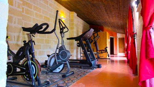 a gym with two exercise bikes in a room at Masseria Incantalupi in San Vito dei Normanni