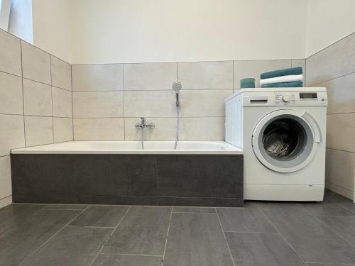 a washer and dryer in a bathroom with a washing machine at Luxus Urlaub auf 1000 Meter im Erholungsparadies in Liebenau
