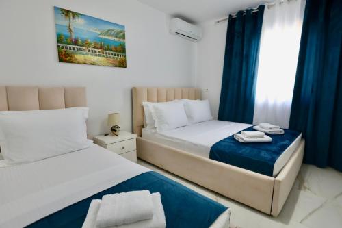 Postel nebo postele na pokoji v ubytování Klejvi Apartments