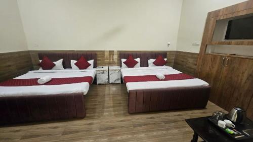 Katil atau katil-katil dalam bilik di Amber Guest House