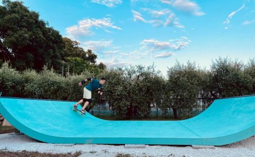a man riding a skateboard on a skateboard ramp at LA CESA Holiday House in San Felice Circeo
