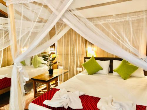 Postel nebo postele na pokoji v ubytování Osheen Homestay Sigiriya