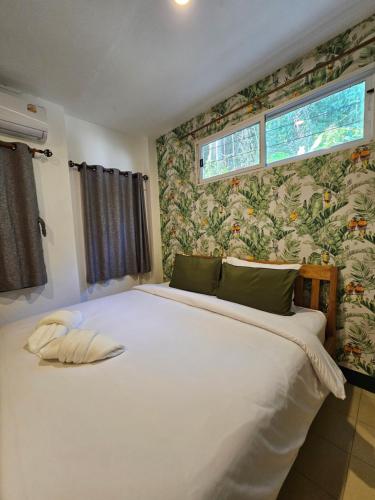 Кровать или кровати в номере Little Green House