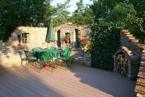 a patio with a table and chairs and an umbrella at Fewo Bärli in Bayersoien