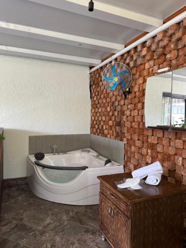 a bathroom with a bath tub and a sink at Maajid Boutique Hotel in Baku
