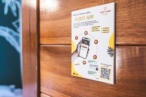 a sign on a door with a cell phone on it at Taki Tambo Lodge in Tarapoto