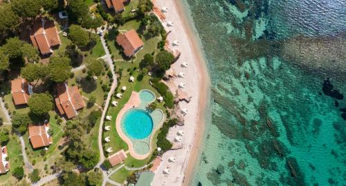 an aerial view of a resort next to the beach at Luna Sardinia in Santa Margherita di Pula