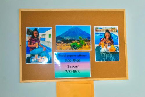 a cork bulletin board with four pictures on it at Hotel Pousada Venus in São Filipe