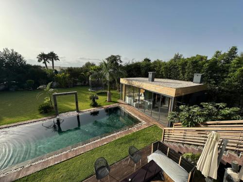 an aerial view of a house with a swimming pool at 1700sqm Unique Villa in Bouskoura in Bouskoura