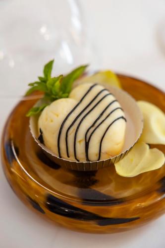 a plate of food with a cupcake on a plate at Hotel Villa Paola in Rimini