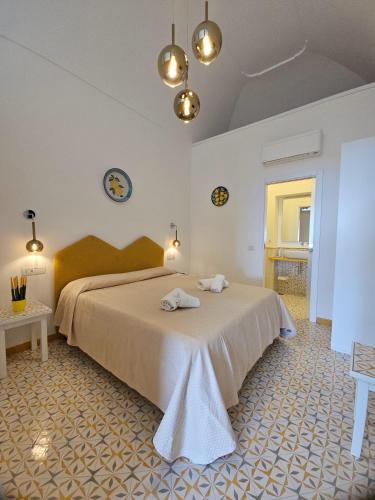a bedroom with a large bed in a room at Hotel Villa Annalara charme and Relax in Amalfi
