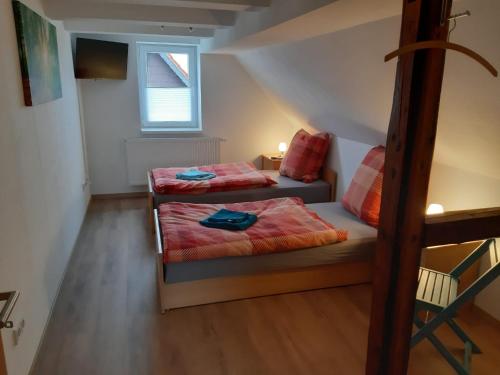 Ένα ή περισσότερα κρεβάτια σε δωμάτιο στο Ferienhaus LeBen