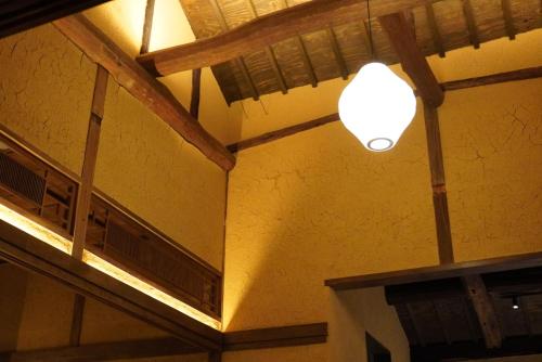 a light on the ceiling of a building at 囲み宿 こわね in Tonosho