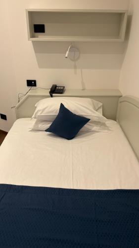 Postel nebo postele na pokoji v ubytování Albergo Cappello e Cadore