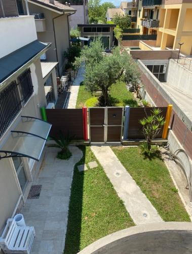 a view from the balcony of a building with a yard at Suite House in Sora