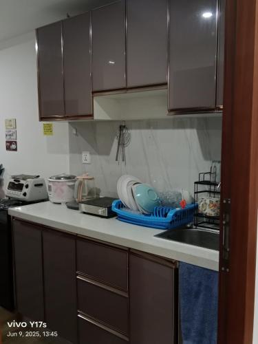 a kitchen with a sink and a counter top at Megatower 3 condotel in Baguio