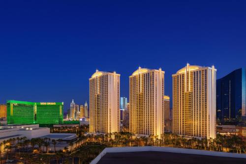 a group of tall buildings in a city at night at MGM Signature Studios by FantasticStay in Las Vegas