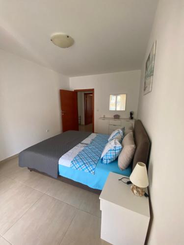 a bedroom with a bed and a couch at Friends in Kravlja
