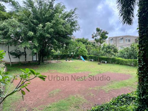 a park with a playground in front of a building at Urban Nest Studio in Homagama