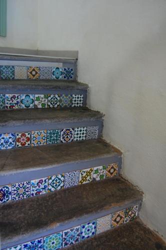 a set of stairs with colorful tiles on them at PRIMA DEL CIELO - appartamento LAGO in Esino Lario