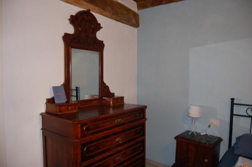 a dresser with a mirror on top of it at PRIMA DEL CIELO - appartamento LAGO in Esino Lario