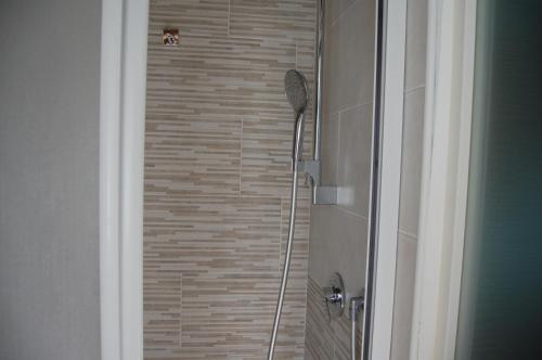 a shower stall in a bathroom with a shower at PRIMA DEL CIELO - appartamento LAGO in Esino Lario
