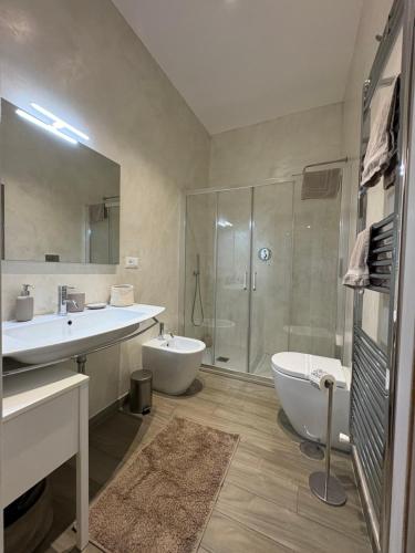 a bathroom with a tub and a sink and a shower at Casa Mar - B&B - in Terracina
