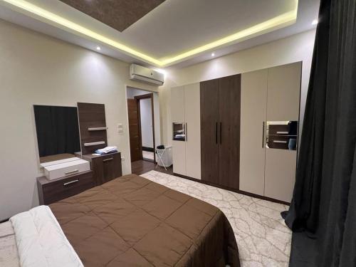 a hotel room with a bed and a bathroom at Modern 3 bedroom Penthouse in Cairo