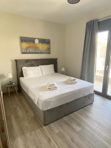 Postel nebo postele na pokoji v ubytování Sarra Apartment Halkidiki