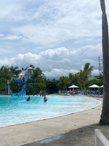 a group of people in the water at a resort at Golden Sun Penthouse VIP in Playa Blanca