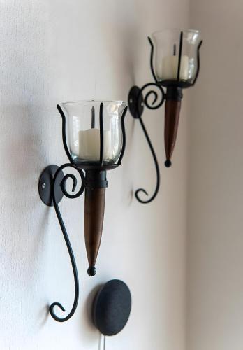a couple of lights hanging on a wall at Ferienhaus Zissi in Wegberg
