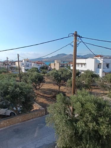 a view of a street with trees and buildings at Niko's apartments 2 in Elafonisos