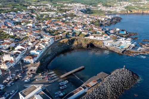an aerial view of a harbor with boats in the water at Vista do Farol in Lagoa