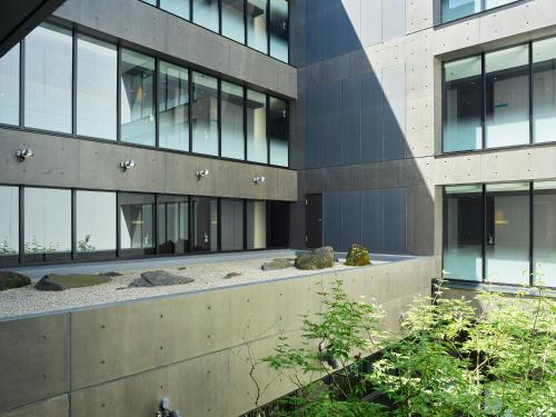 an external view of a tall building with windows at Mitsui Garden Hotel Kyoto Shinmachi Bettei in Kyoto